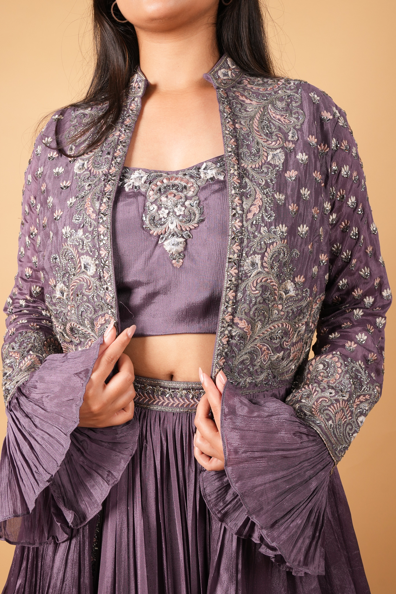 Surbhi Puranik pairs up her purple lehenga by Preesha with a crop jacket!